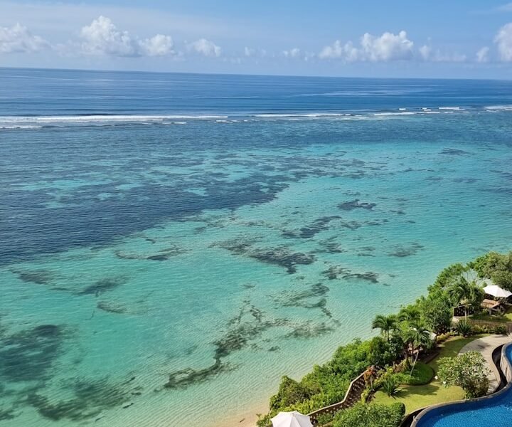 a view of the ocean from the top of a building