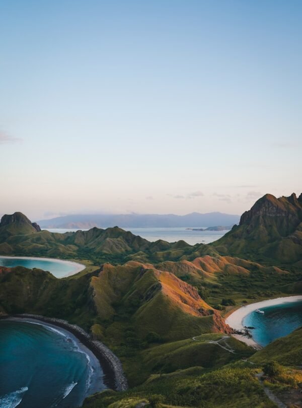 an aerial view of the coastline of a tropical island